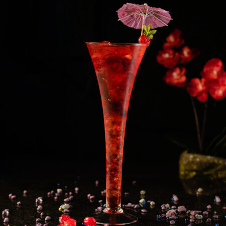 Long Trumpet Champagne Cocktail Glass Filled with red drink