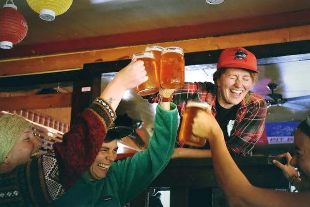 Several guys drinking beer together