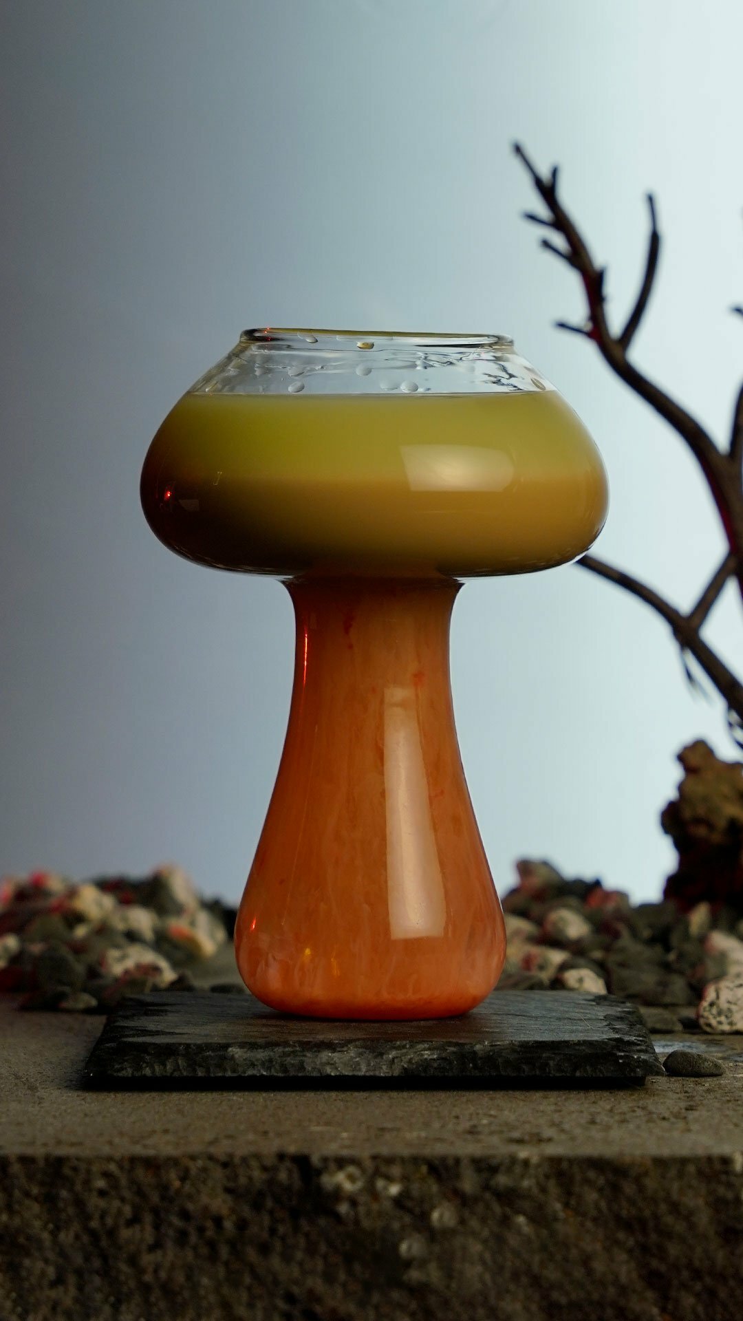 Four colors layered cocktail that resembles a nuclear effect