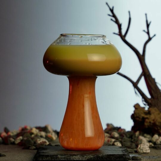 Three colored cocktail inside a mushroom glass