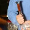 Bartender shaving an ice cube with the Anvil Head Ice Pick