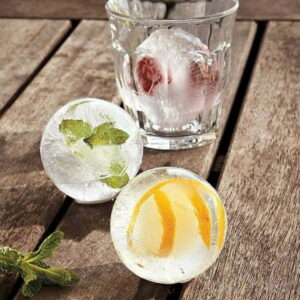 Ice cubes in the shape of balls for decorating cocktail glasses