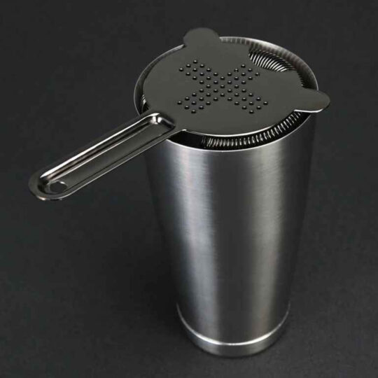 The Hawthorne Plus Strainer Black Fixed over a Shaker
