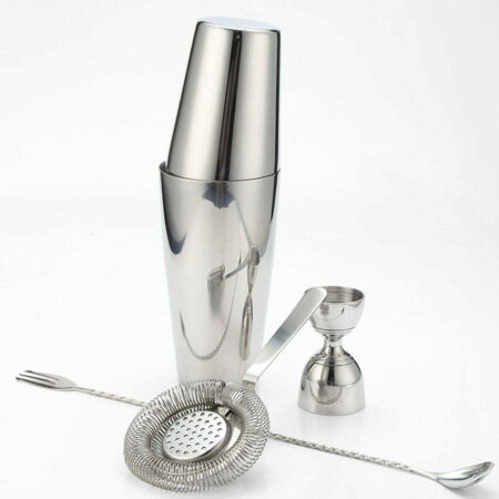 Four piece stainless steel cocktail bartending set of a Boston Shaker and a Hawthorne Strainer and a Bar Spoon and a Jigger