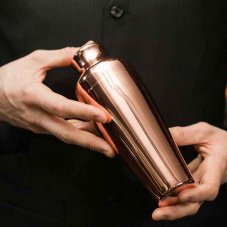 Copper color plated Stainless Steel Parisian French Cocktail Shaker held in two hands