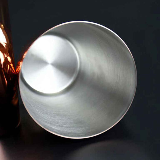 The inside of a cocktail shaker tin