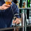 Bartender Pouring Alcohol into the Wrapped Japanese Double Jigger