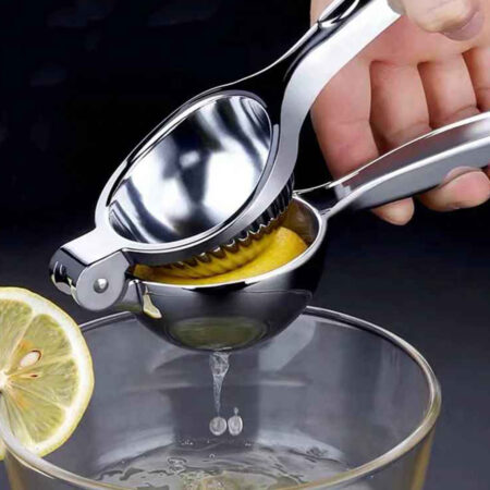 Groovy Fruit Squeezer Squeezing a lemon into a large glass