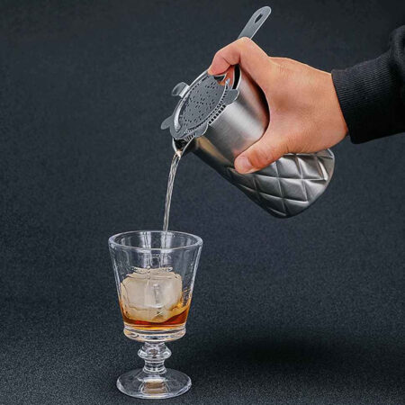 Double Walled Mixing Cup pouring liquid inside a shot glass