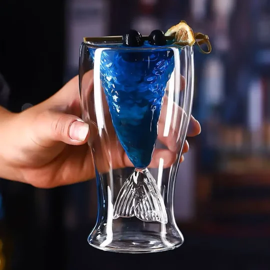 Mermaid’s Tail Cocktail Glass with blue drink, blackberries, and lemon garnish, perfect for themed parties