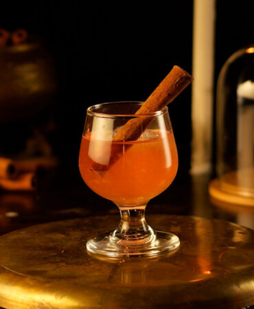 Smoked Cinnamon Whisky Cocktail served in a Snifter glass