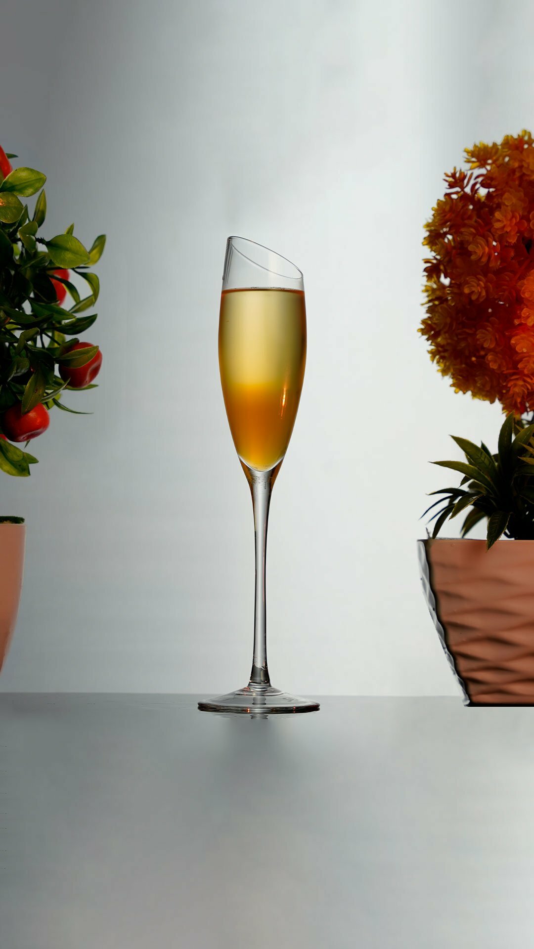 Orange Champagne Cocktail inside a flute champagne glass