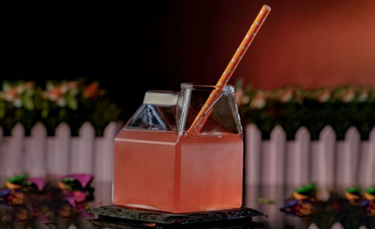 Orange Red Cocktail Inside a Hut Glass