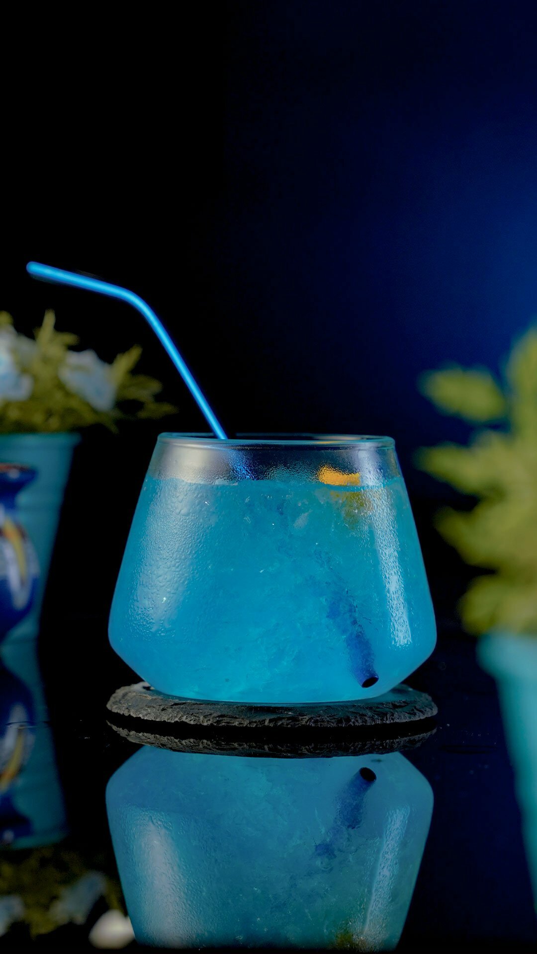 Short Exquisite Glass filled with a blue train cocktail