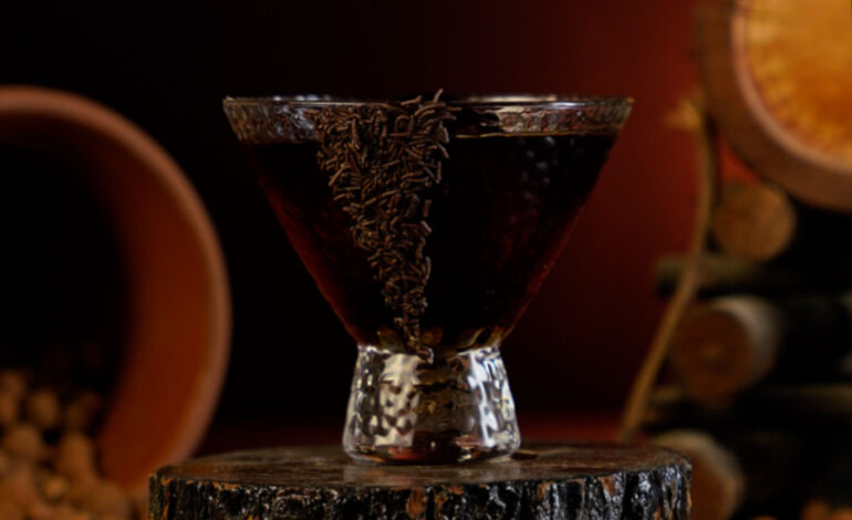 Brown Chocolate Cocktail in a short Martini Glass garnished with chocolate sprinkles