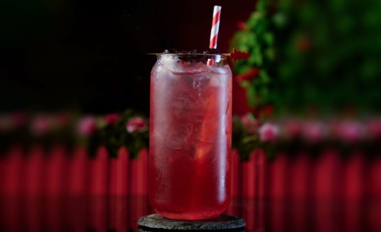 Large Glass Can filled with a red cocktail