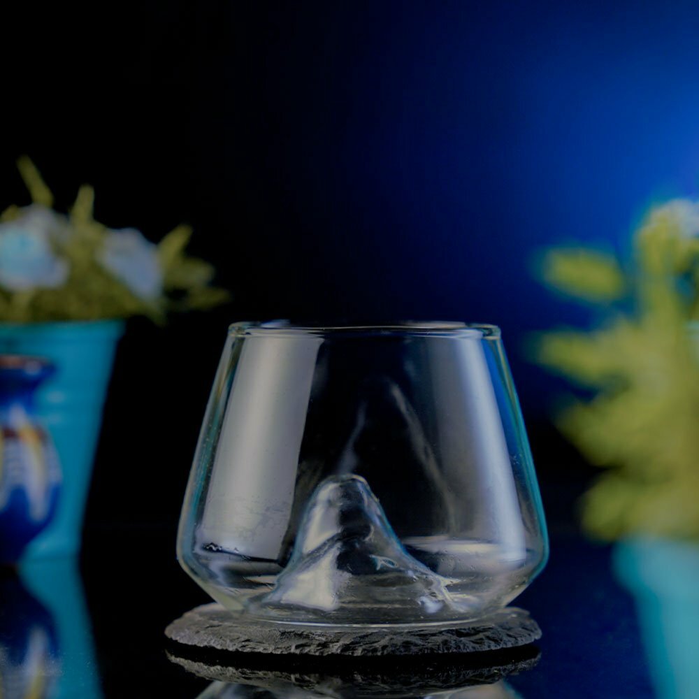 Short Cocktail Glass that features a mountain design inside it