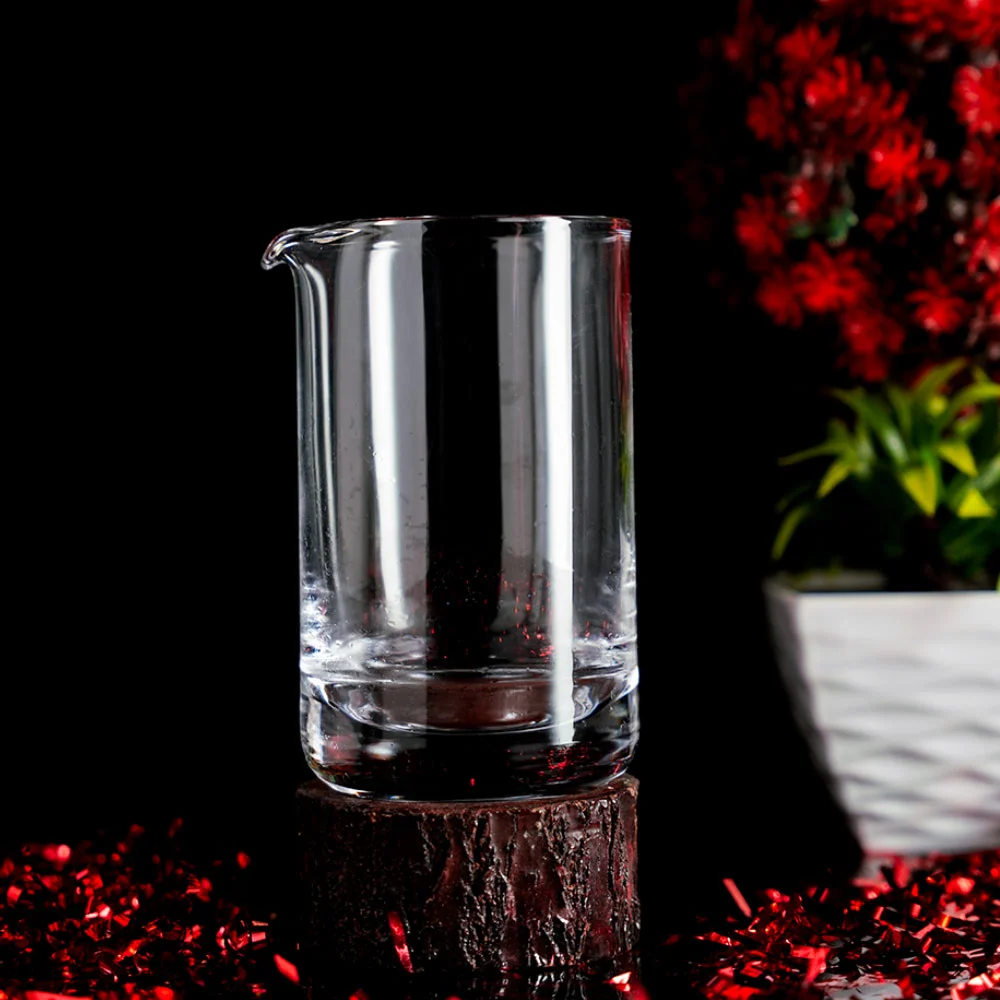 Transparent Spouted Glass used for Mixing Cocktails with a Spoon