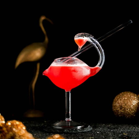 Drooling Red Cocktail inside a beautiful flamingo glass