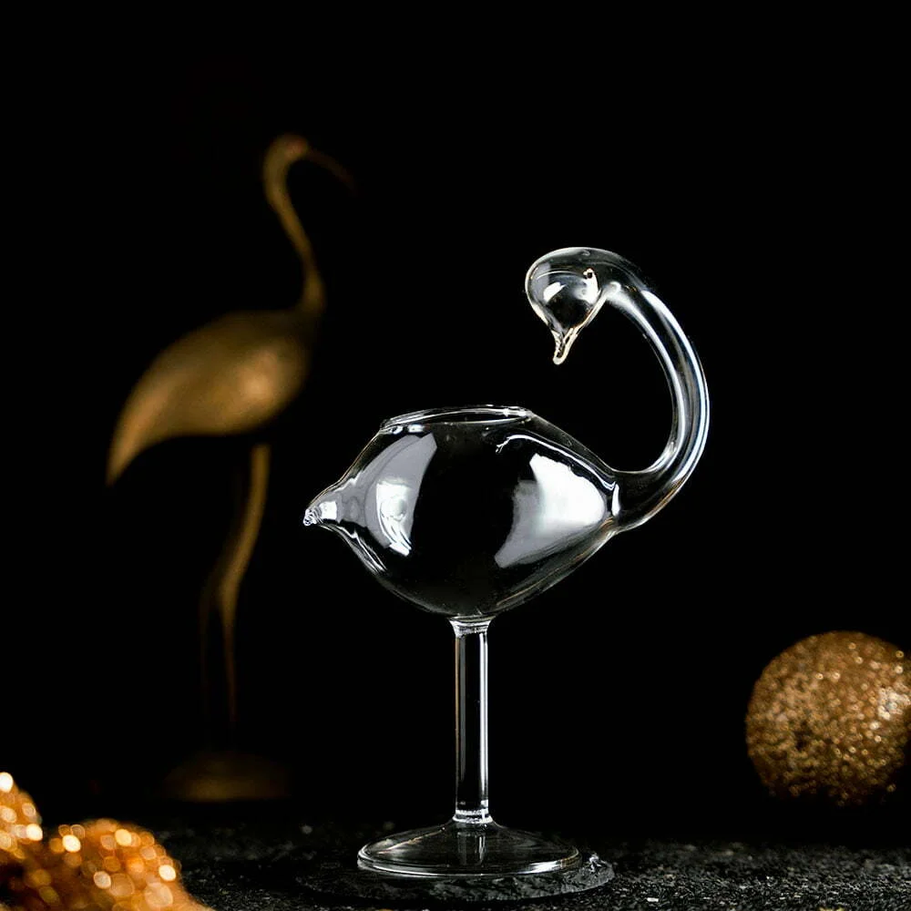 Empty Flamingo Cocktail Glass with gold props around it