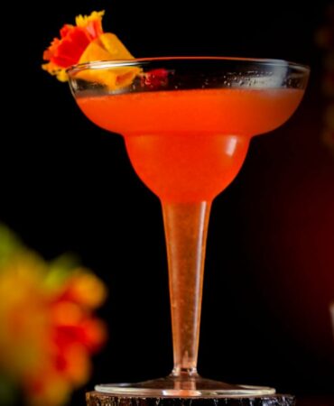 Orange Cocktail inside a Margarita Glass