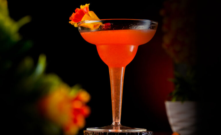 Orange Cocktail inside a Margarita Glass