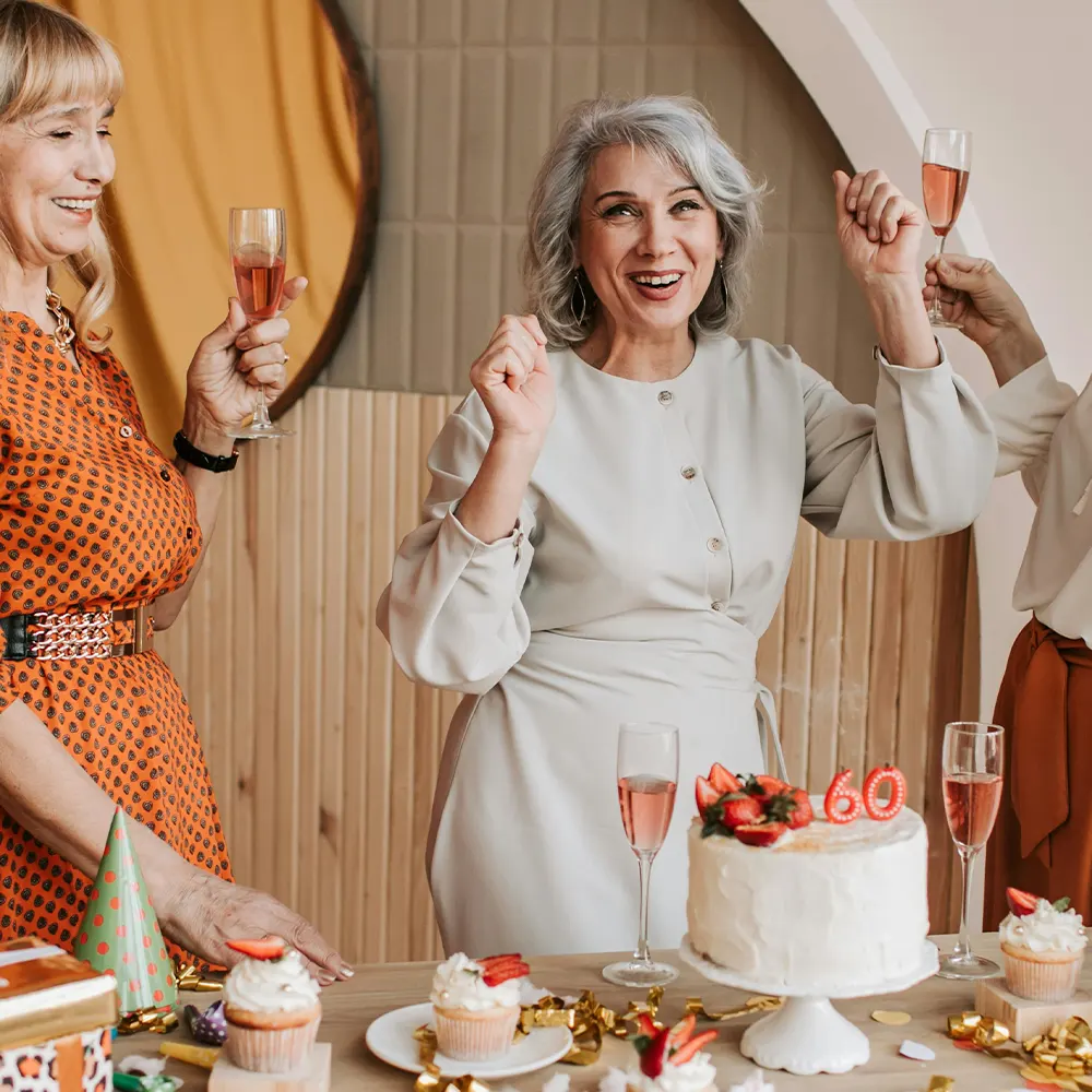 Group of people drinking at a lively gathering, highlighting the festive and social atmosphere.