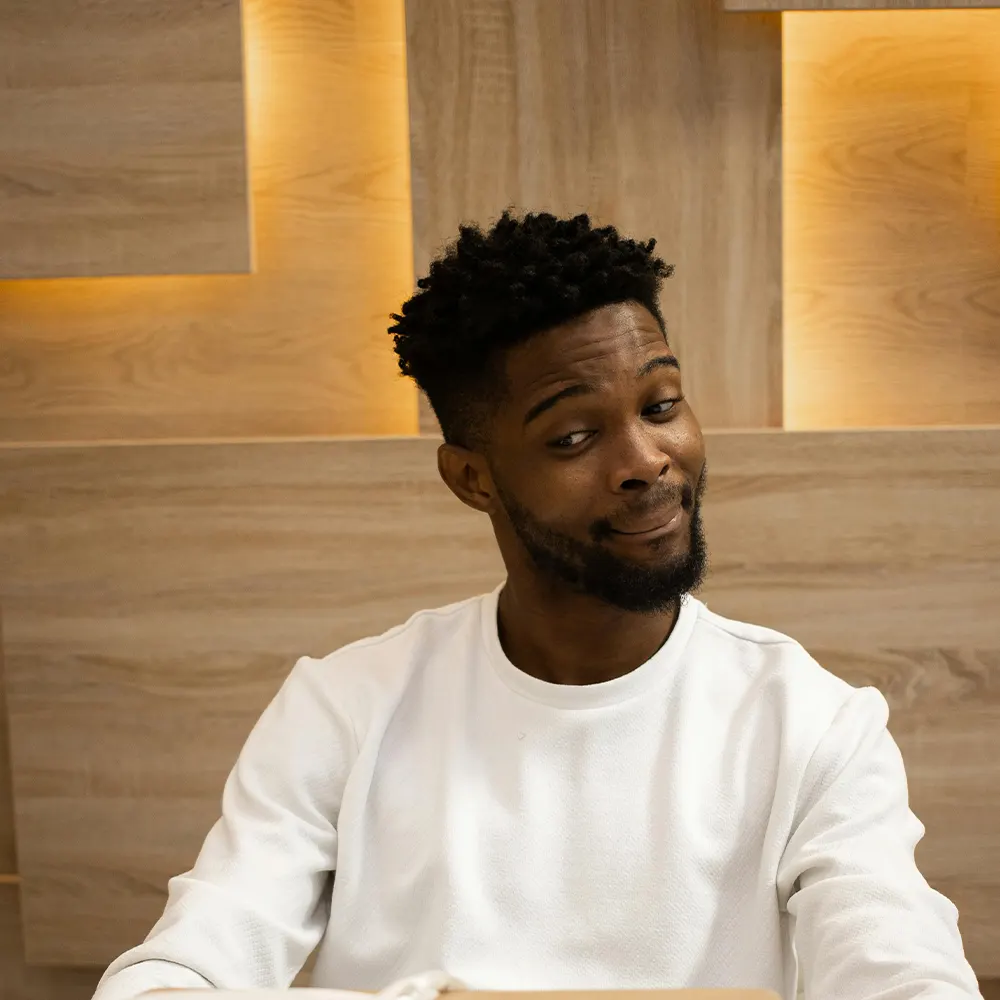 An individual happily admiring their new drinkware, showcasing the assurance and joy of premium drinkware backed by a 100% satisfaction guarantee.