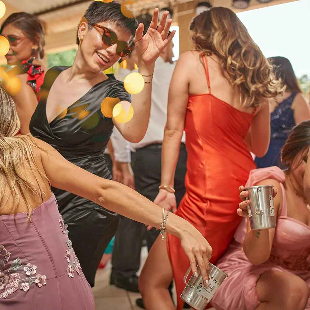 Group of people drinking cocktails and enjoying a party.