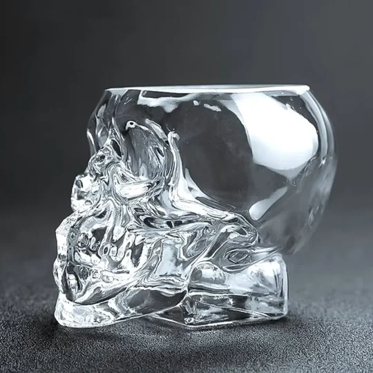 Stemless, skull-shaped Grim Reaper Glass holding 350ml, perfect for serving dramatic cocktails or as Halloween drinkware.