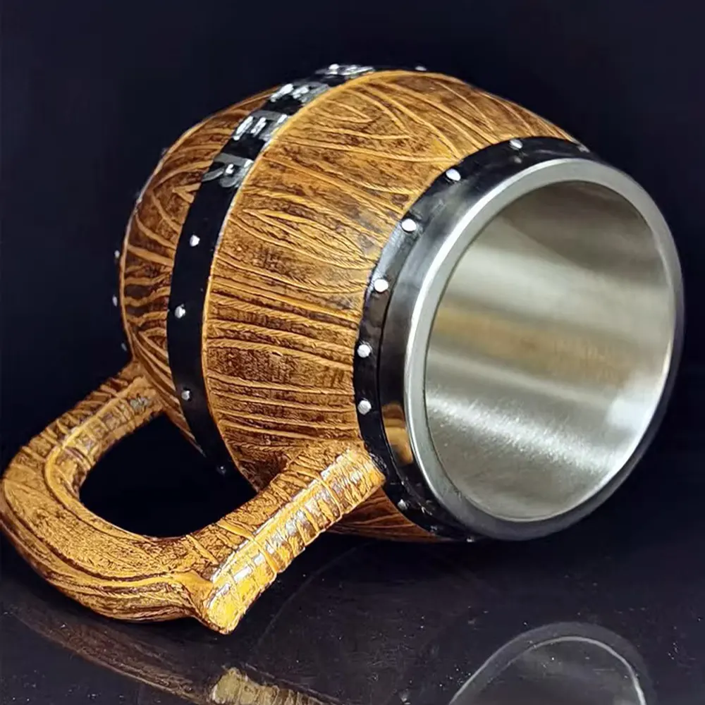 Viking-themed beer mug resembling a wooden barrel with black metal bands and silver rivets, featuring a wood grain texture and a metallic interior.