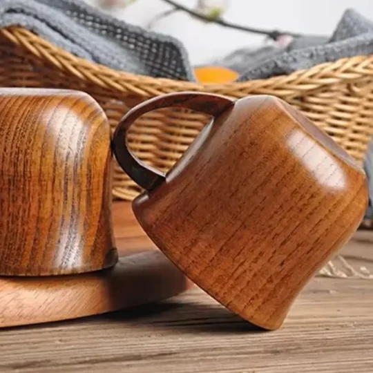 Pair of rustic wooden cocktail mugs by Skol, The Woodland Warmer, with visible grain, ideal for eco-friendly hot cocktails.