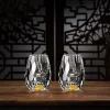 A pair of luxurious gold gemstone shot glasses with hand-blown faceted designs and thick gold-infused bases, perfect for serving premium spirits. Each 0.5 oz glass is part of an exclusive collection, highlighting high-quality craftsmanship and elegance.