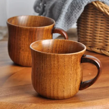 Set of two rustic wooden cocktail mugs by Skol, The Woodland Warmer, with visible grain, ideal for eco-friendly hot cocktails.