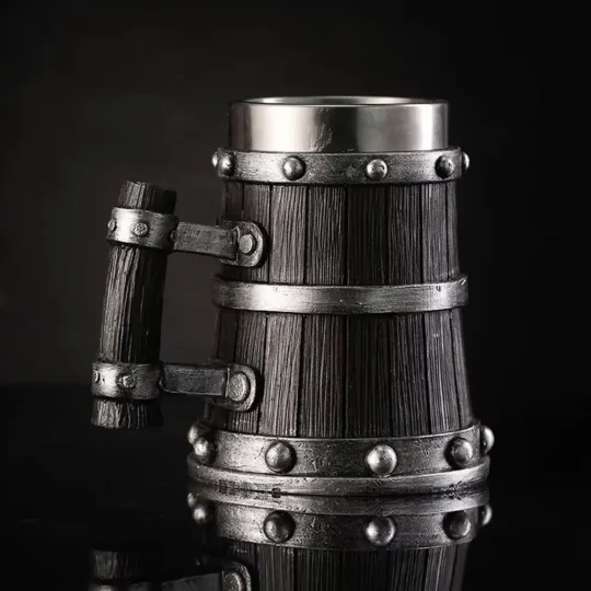 Angled view of the Viking Tankard, showcasing the detailed wood-like resin exterior and robust handle with metal rivets, embodying the spirit of Viking craftsmanship.