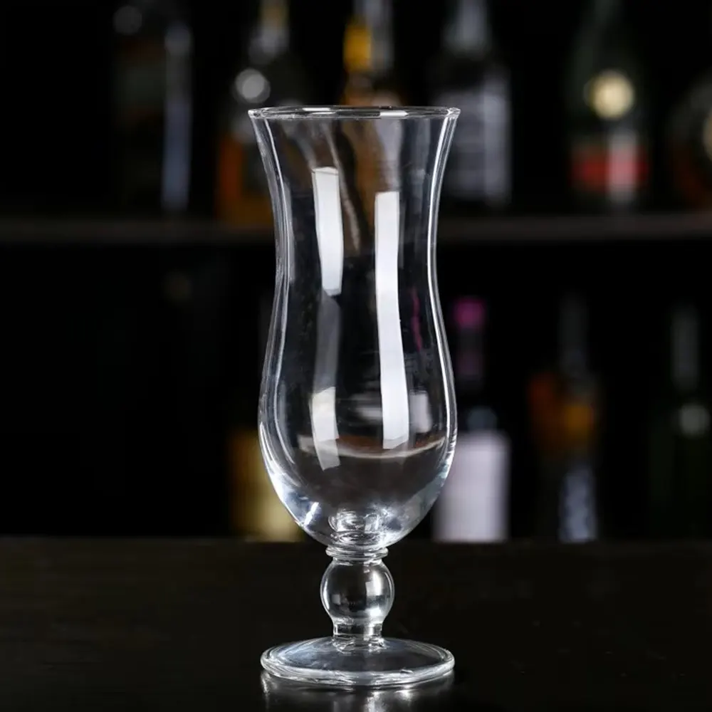 Empty 420 ml Tempest Twist Glass with a tulip shape, ideal for cocktails, on a bar counter.