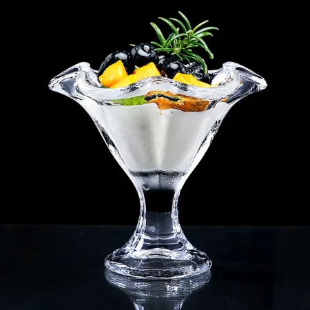 Eco-friendly The Elegant Tulip Glass with unique tulip-like shape designed for cocktails, showcasing wavy rim and clear stem on dark background.