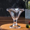 Eco-friendly The Elegant Tulip Glass with unique tulip-like shape designed for cocktails, showcasing wavy rim and clear stem on dark background