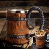 A robust Valhalla Vikings Stein with a capacity of 600 ml, featuring a wooden body bound by resin and stainless steel bands, with a curved handle resembling Viking design elements.